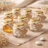 Barattolo esagonale in vetro da 45 ml riempito con miele, ideale per bomboniere artigianali monodose